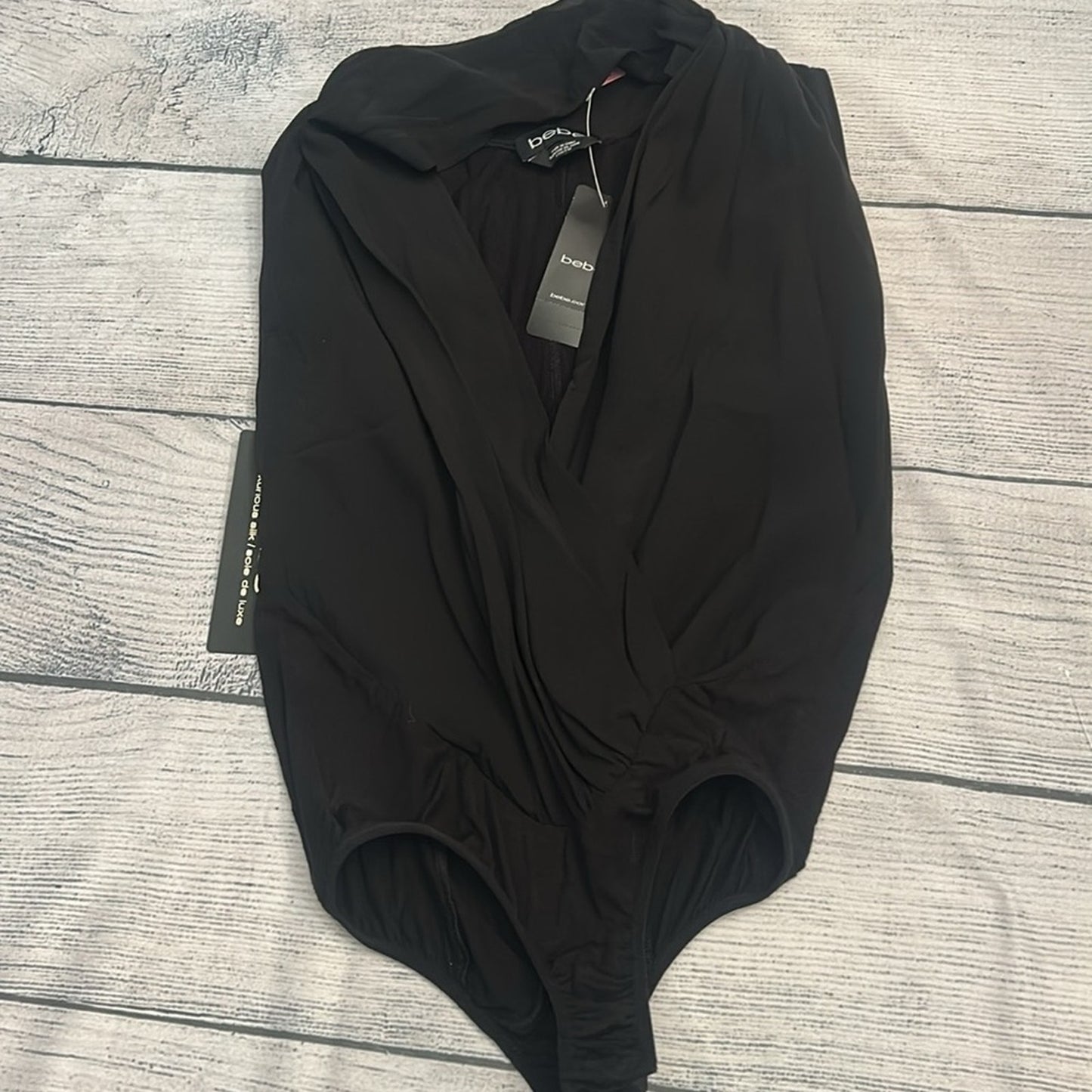 NWT Bebe silk black bodysuit - size XXS